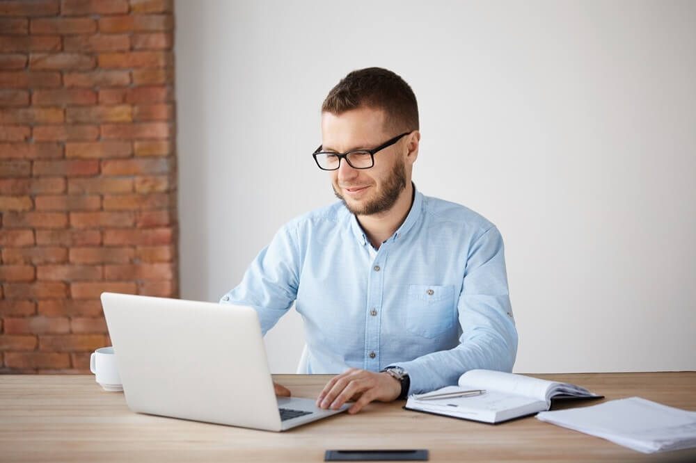 man working on laptop